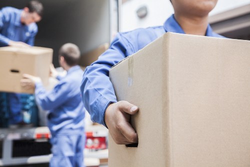 Packing fragile household items in a Colliers Wood home