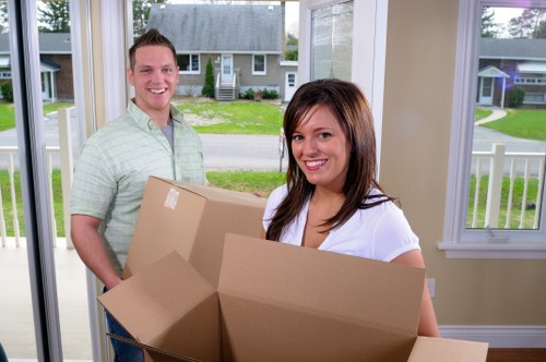 Office moving team handling furniture in Colliers Wood
