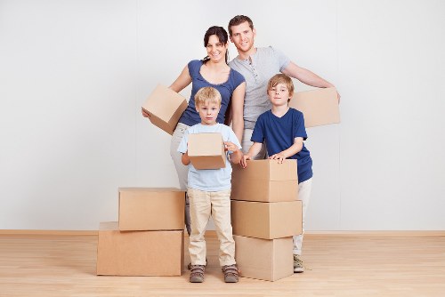 Professional removals crew handling household items in Colliers Wood