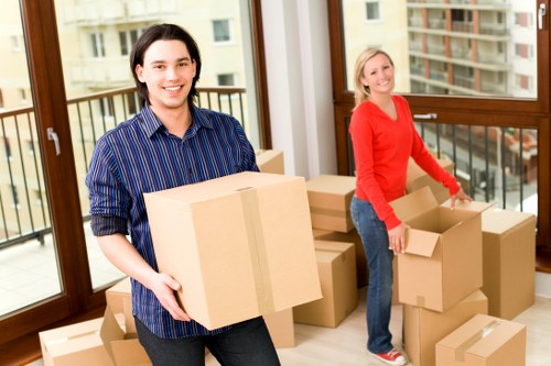 Professional unpacking of household items after arrival