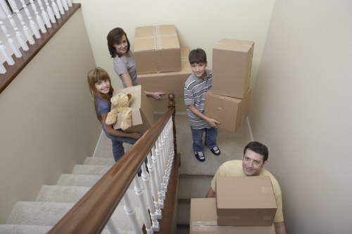 Packed boxes and furniture ready for a local move in Colliers Wood